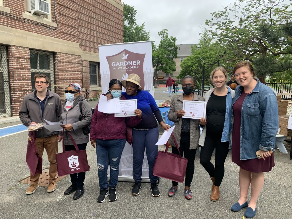 The survival literacy students are pictured with their teacher at the end of the year celebration.