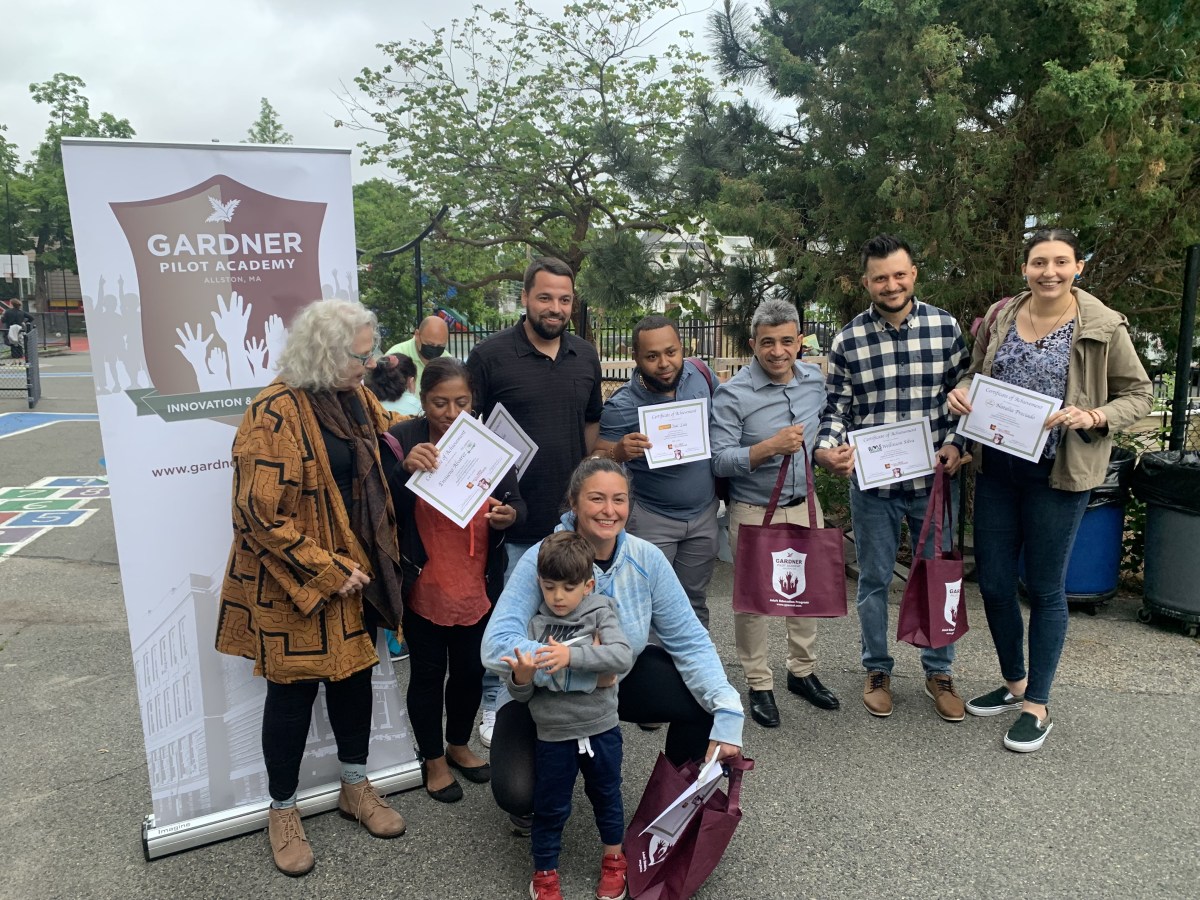 The English for Entrepreneur students are pictured with their teacher and volunteers at the end of the year celebration.