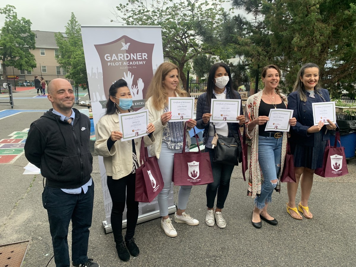 The advanced students are pictured with their teacher and volunteers at the end of the year celebration.